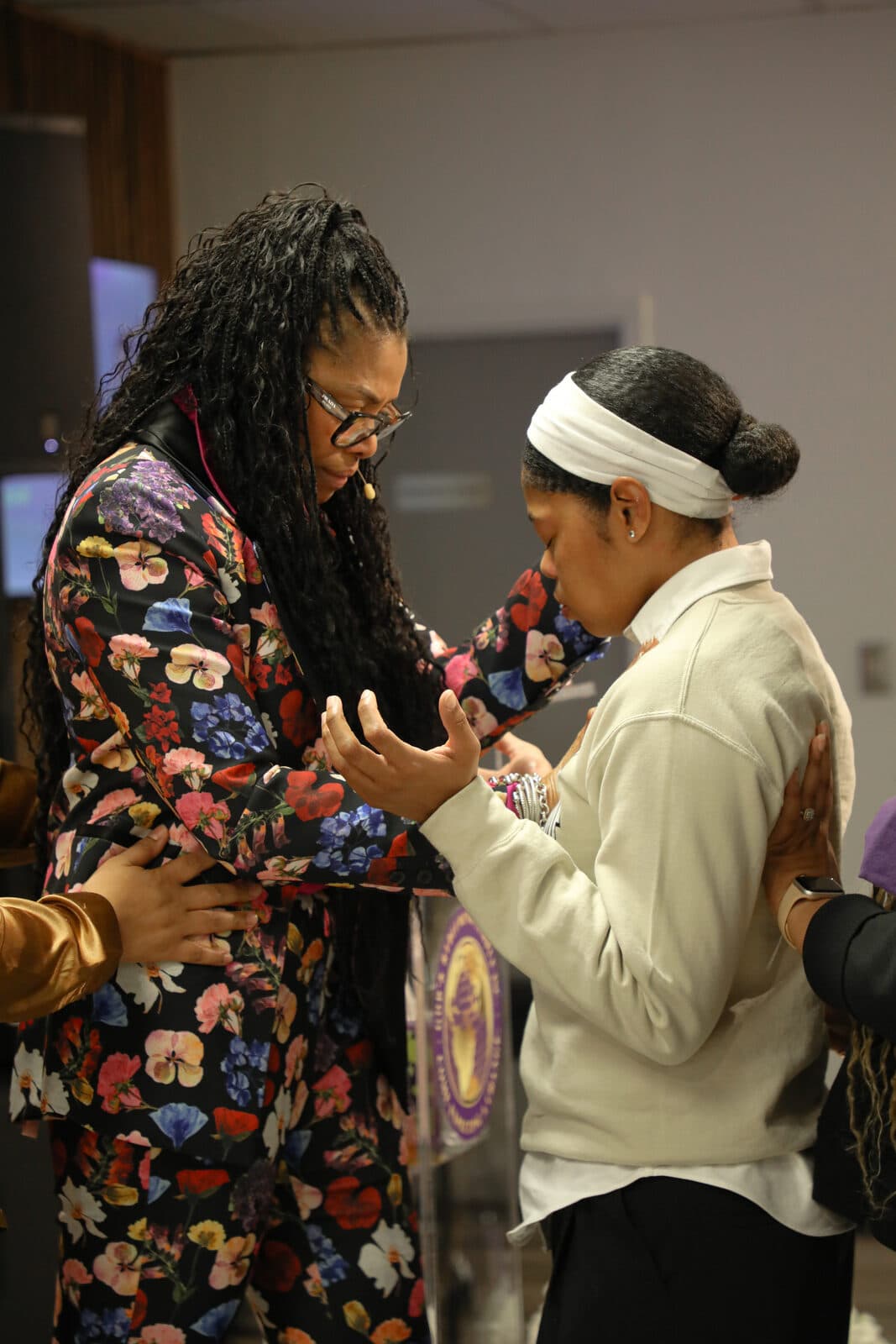 Two women praying together